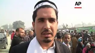 School children go back to the site of Taliban attack; protests at gates