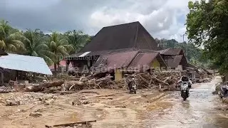 Survivors reflect on Indonesia's floods as receding water reveals swathe of destruction