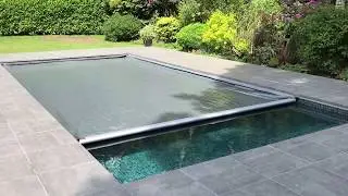 Aquamatic swimming pool safety cover with Hidden Leading Edge Bar  Lid system