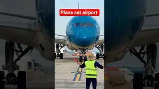 A real shot of the airport ground staff directing the plane into the parking position! #aviation