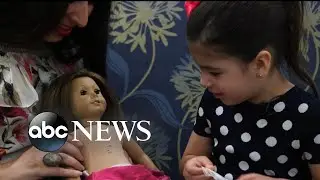 Little girl and her American Girl doll have matching surgery scars