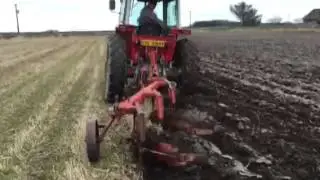 MF 575 ploughing