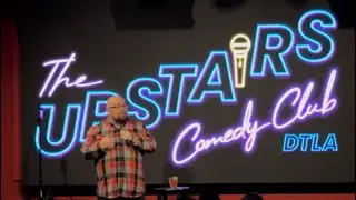 Comedian Mario Reyes performs on the Xmas edition of The Refried Comedy Show