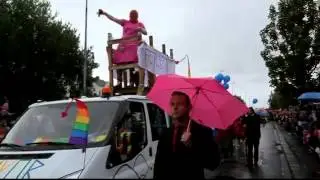 The Mayor of Reykjavik Jon Gnarr stands on the roof of a car in a pink dress Balaclava Pussy Riot