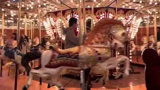 Alexander riding the carousel at Miners Landing at Pier 57 in Seattle