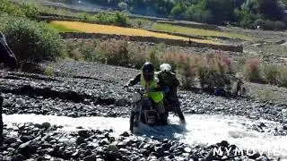 Crossing bikes through fast flowing water.🏍️