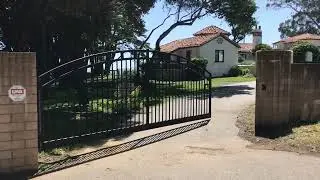 Massive driveway gate closes easily in heavy winds with Liftmaster CSL24UL gate operator