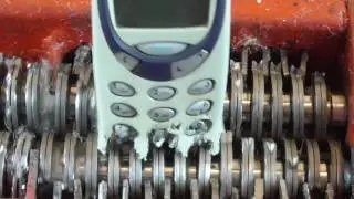 Papper shredder: shredding Nokia 3310 mobile phone