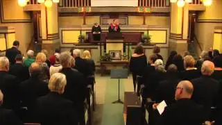 Rev. Alan Taylor opens the memorial service of Greg Risberg