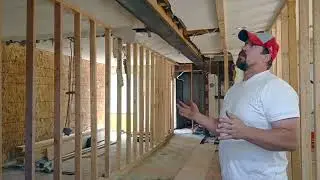 Installing a 3,000 pound, 30 foot long beam in a 1930s two story home in East Salt Lake City.