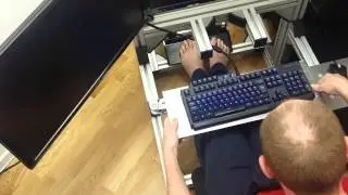 Keyboard tray function on sim racing rig