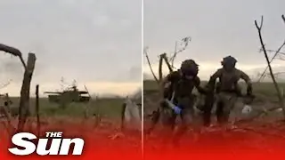 Ukrainian soldiers take cover from Russian tanks near Melitopol