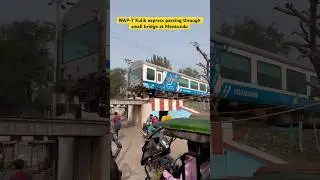 WAP-7 Kulik express passing through a small bridge at Mankundu
