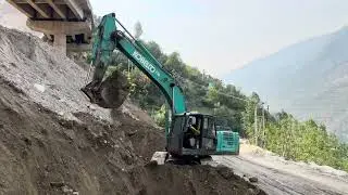 pocklain machine shifting soil from front to back for foundation of create wall