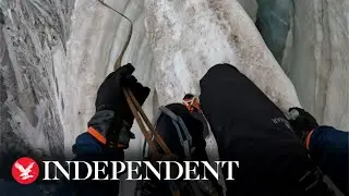Climber navigates terrifying snow bridge above 3,000 metre high crevasse in the French Alps
