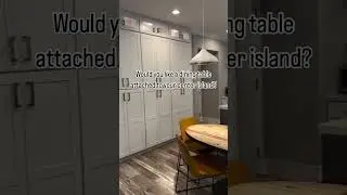 Would you want your dining table built right into your kitchen island? 🍽️✨ This sleek setup blends