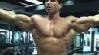 Bodybuilder / physique model Sagi Kalev posing