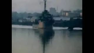 Esquimalt Harbour 1951 with a destroyer and First Nation canoes