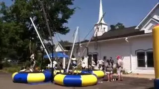 Kids jump at Dragon on the Lake Festival in Lake Orion.