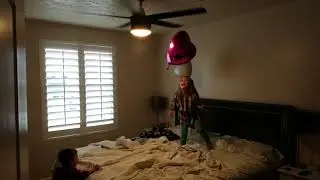 Twins and balloons and a ceiling fan means a party