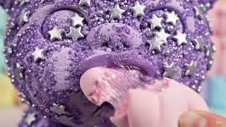 dark purple girl stars eating a pink marshmallow
