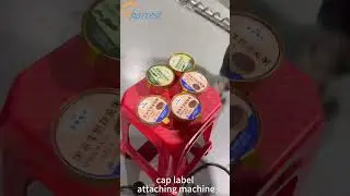 Upper surface labeling machine, cap top labeling machine, cap label attaching machine