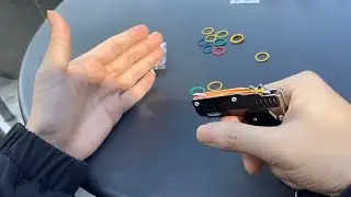 Mini Folding Rubber Band Gun Toy Keychain 2021