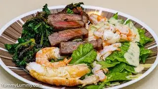 Moreton Bay bugs, Banana prawns, and Wagyu porterhouse steak with crispy palettes and Caesar salad