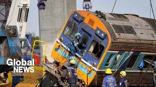 Construction crane falls on train in Thailand, killing at least 32