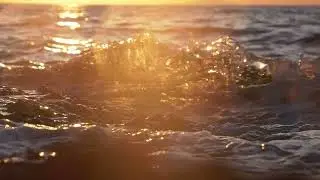 Sunset wave splash and droplets, slow motion | Free stock footage