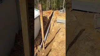 DIY outdoor kitchen running water line into foundation