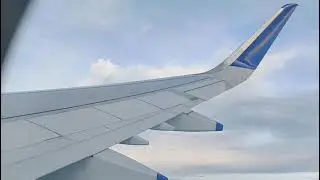 Indigo Pune to New Delhi airport flight travel sky scene.
