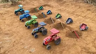 The tractor followed behind and took the soil in the trolley.