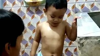 The activity of a father bathing a child.