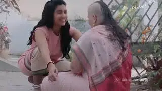 Women headshave by young girl