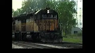 MILWAUKEE ROAD FREIGHT TO LOUISVILLE AT CAL PARK CROSSING, IL 5/16/82. MORE VINTAGE FREIGHT CARS!