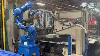 Robotic tending of a sheet metal parts folder press with a Yaskawa GP12 robot
