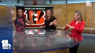 WBAL honors football bet with sister station WLWT