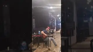 Jason Woodward at sings a pop medley at open mic