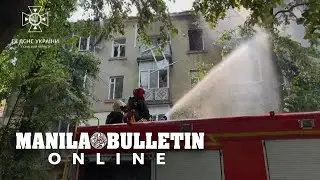 Firefighters work on the site of a deadly Russian drone strike on Ukraine's Sumy
