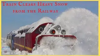 Train Clearing Heavy Snow from the Railway - Train Snow Blower - Heavy Rail Machinery