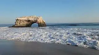 Ocean waves rolling in at Natural Bridges State Beach, Santa Cruz, California.
