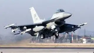 F-16 landing with tire smoke