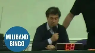 Ed Miliband reading numbers at community bingo night