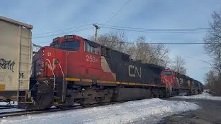 CSX 3173 ES44AH “P&LE sticker” leads CSX M404 with 2 CN Units trailing at Piscataway (ok crew)