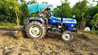 sonalika Di 745 iii gorkha series tractor working land levelling in village area