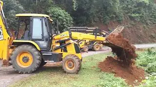 jcb backhoe loader clearing road blockage ## landslide and block the road