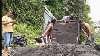 Piles of Black Sand for Casting Material are Loaded Into the Truck Bed