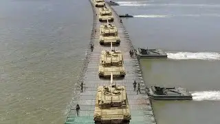 US & Allies Build Massive Floating Bridge to Drive Tanks Across River