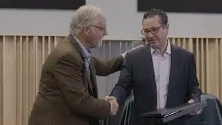 Peter McGrath of Wilson Audio presents Maier Shadi with the Wilson Dealer of the Year award for 2018